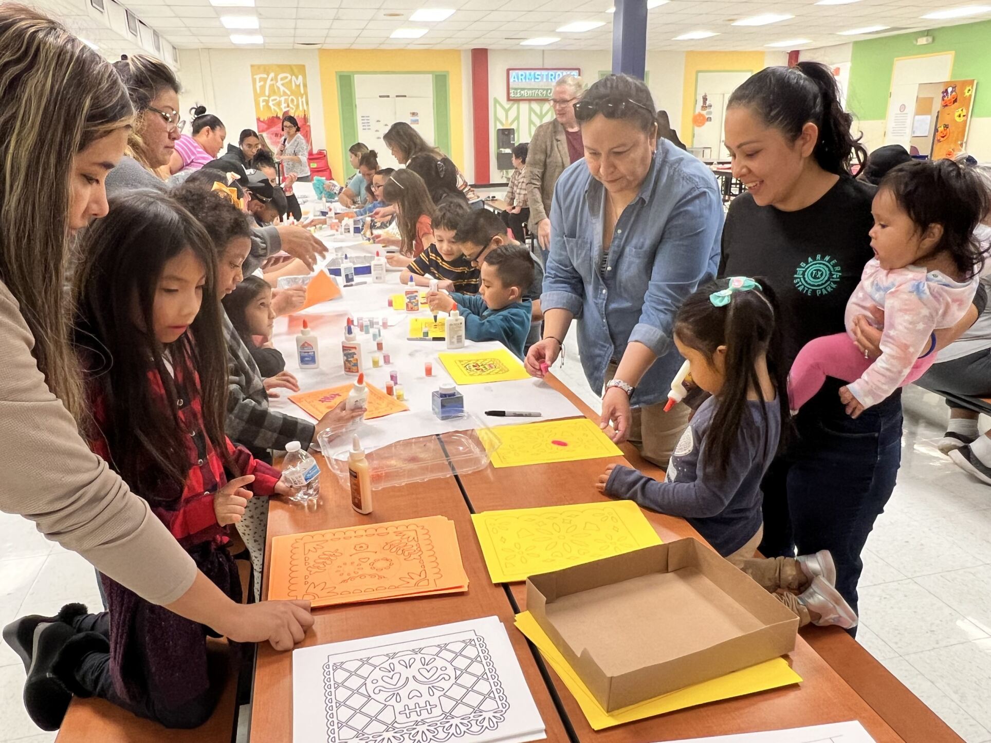 lady helping kids in event