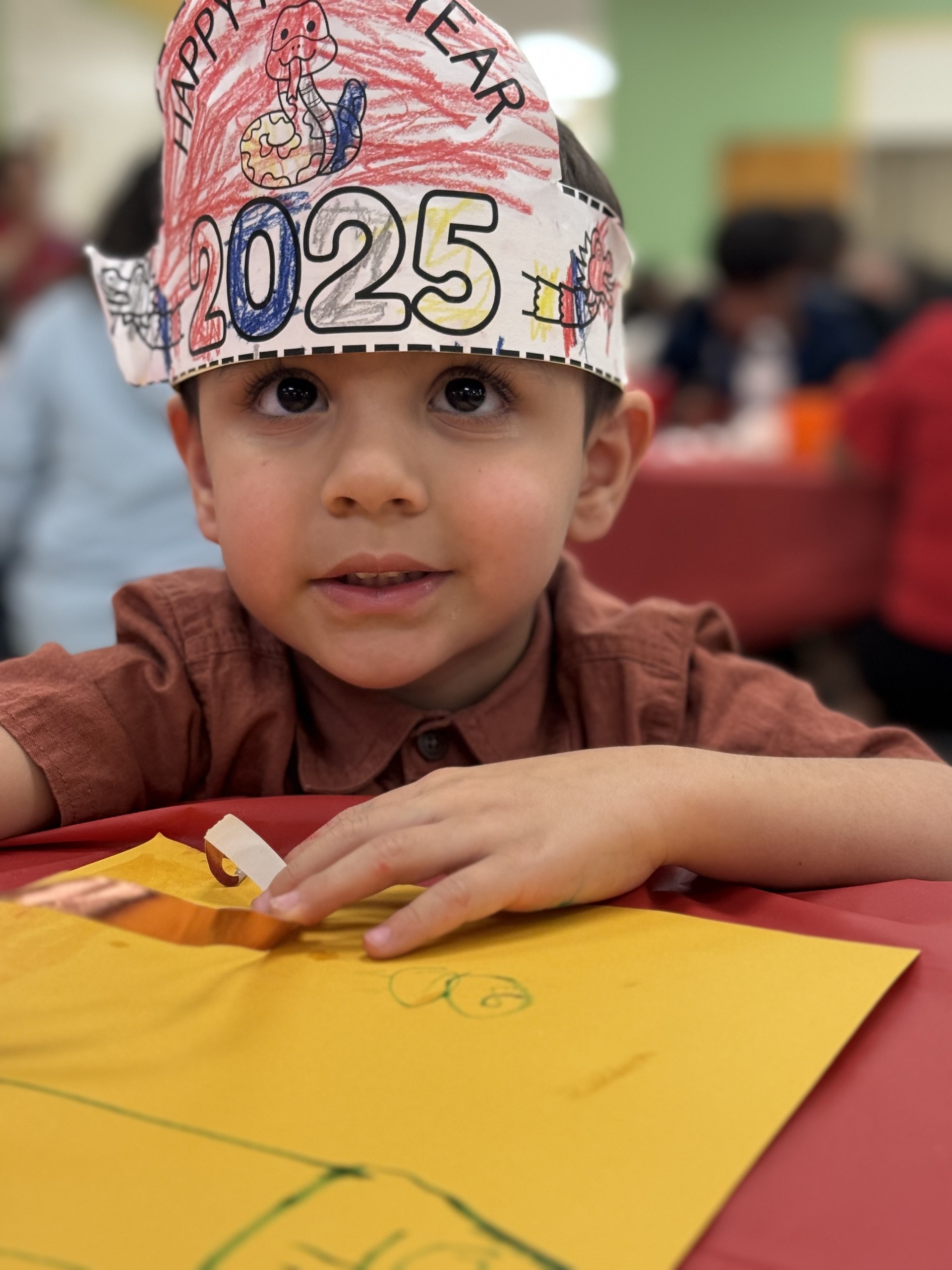 kid with 2025 hat